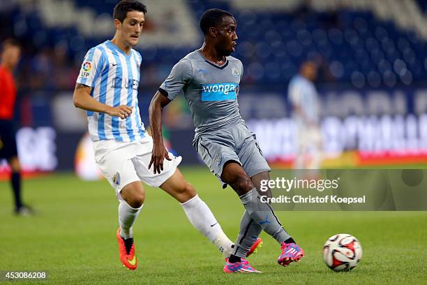 Vurnon Anita of Newcastle United runs with the ball during the match between FC Malaga and Newcastle United as part of the Schalke 04 Cup Day at...