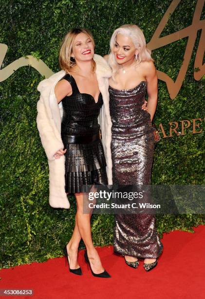 Kate Moss and Rita Ora attend the British Fashion Awards 2013 at London Coliseum on December 2, 2013 in London, England.