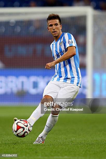 Ayoze Perez of Malaga runs with the ball during the match between FC Malaga and Newcastle United as part of the Schalke 04 Cup Day at Veltins-Arena...