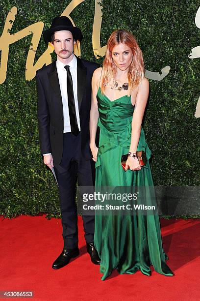 Sienna Miller and Tom Sturridge attend the British Fashion Awards 2013 at London Coliseum on December 2, 2013 in London, England.