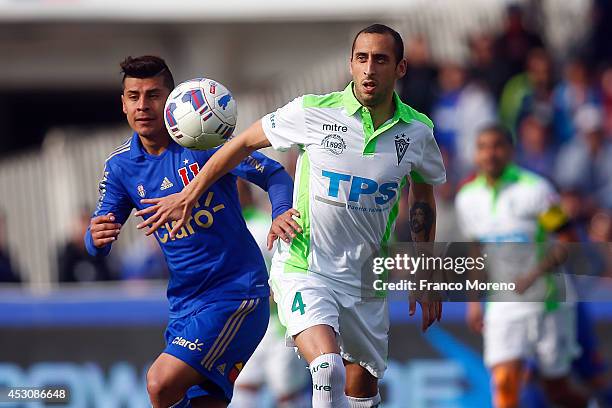 Patricio Rubio of U de Chile looks at the ball as Mauricio Prieto of Wanderers protects the ball during a match between U de Chile and Wanderers as...