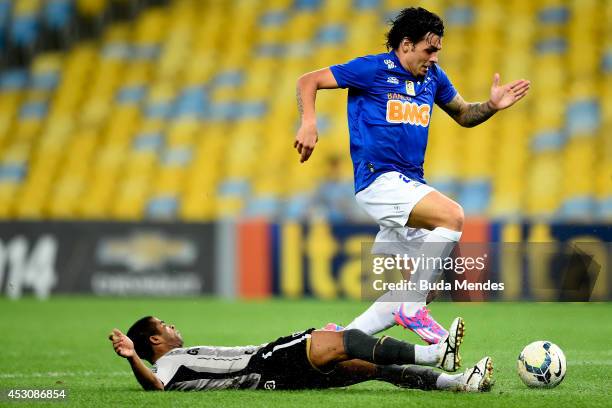Junior Cesar of Botafogo struggles for the ball with Ricardo Goulart of Cruzeiro during a match between Botafogo and Cruzeiro as part of Brasileirao...