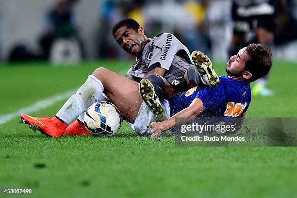 Junior Cesar of Botafogo struggles for the ball with Everton Ribeiro of Cruzeiro during a match between Botafogo and Cruzeiro as part of Brasileirao...