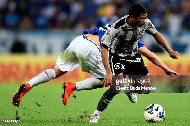 Junior Cesar of Botafogo struggles for the ball with Everton Ribeiro of Cruzeiro during a match between Botafogo and Cruzeiro as part of Brasileirao...