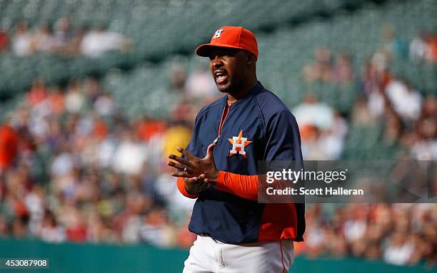 Bo Porter of the Houston Astros questions a call during the first inning of their game with the Toronto Blue Jays at Minute Maid Park on August 2,...