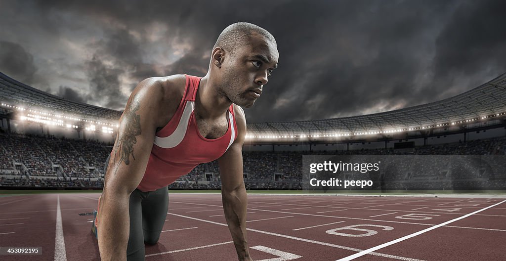 Atleta concentra-se antes de uma corrida
