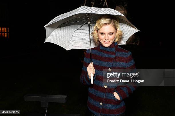 Emelia Fox turns on The Goring's Fulton Umbrella tree at The Goring Hotel on December 2, 2013 in London, England.