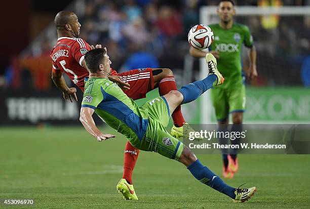 Victor Bernardez of the San Jose Earthquakes battle for the ball with Kenny Cooper of the Seattle Sounder FC during the second half of an MLS Soccer...