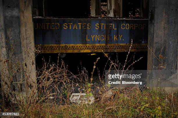 Discarded piece of railroad equipment sits beneath an abandoned coal tipple at a U.S. Steel mine in Lynch, Kentucky, U.S., on Tuesday, Nov. 5, 2013....