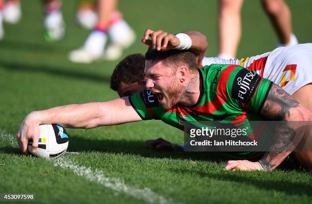 Chris McQueen of the Rabbitohs scores a try during the round 21 NRL match between the South Sydney Rabbitohs and the Newcastle Knights on August 3,...