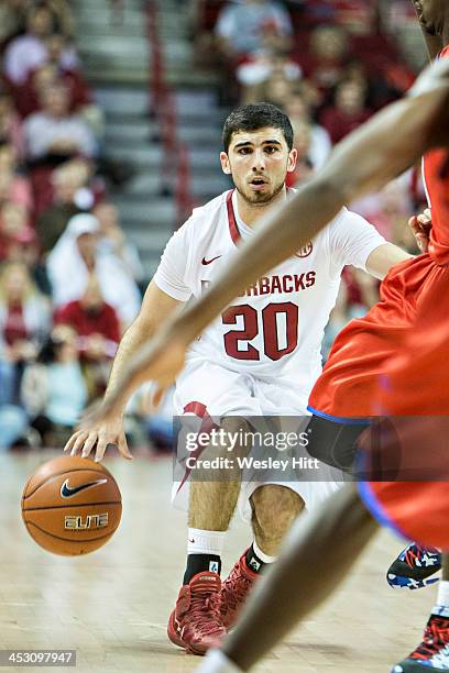 Kikko Haydar of the Arkansas Razorbacks brings the ball down the court against the SMU Mustangs at Bud Walton Arena on November 18, 2013 in...