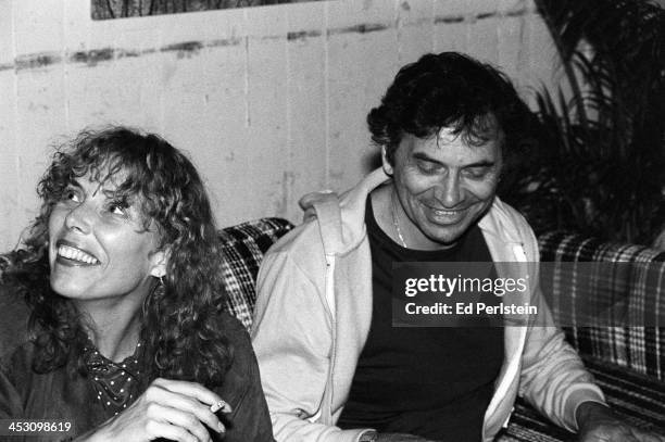 Joni Mitchell poses backstage with promoter Bill Graham during the Berkeley Jazz Festival at the Greek Theatre in May 1979 in Berkeley, California.