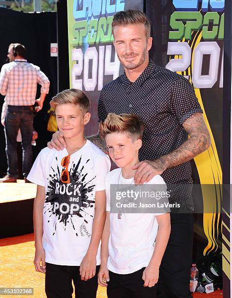 David Beckham and sons Romeo Beckham and Cruz Beckham attend the 2014 Nickelodeon Kids' Choice Sports Awards at Pauley Pavilion on July 17, 2014 in...