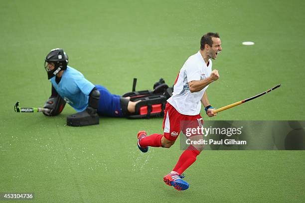 Nick Catlin of England celebrates scoring a penalty against Goalkeeper Devon Manchester of New Zealnd during a penalty shoot out in the bronze medal...