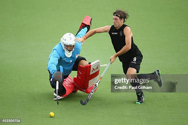 Blair Hilton of New Zealand takes a penalty against Goalkeeper George Pinner of England during a penalty shoot out in the bronze medal match between...
