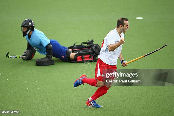 Nick Catlin of England celebrates scoring a penalty against Goalkeeper Devon Manchester of New Zealnd during a penalty shoot out in the bronze medal...