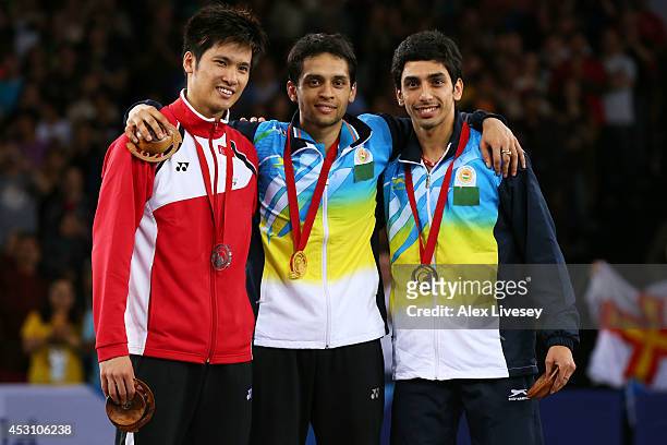 Silver medalist Derek Wong of Singapore, gold medalist Kashyap Parupalli of India and bronze medalist RV Gurusaidutt of India pose in the medal...