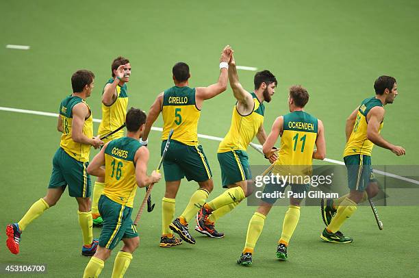 Chris Ciriello of Australia celebrates with his team-mates after scoring the second goal for Australia in the Men's Gold Mdal Match Final between...