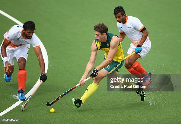 Simon Orchard of Australia prepare battles for the ball with Manpreet Singh of India during the Men's Gold Medal Match Final between India and...