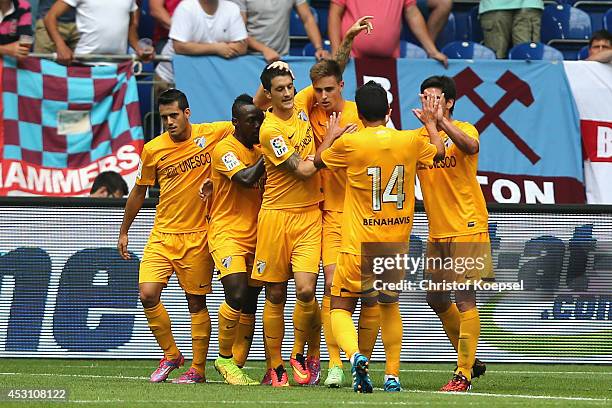Ezequiel Rescaldani of Malaga celebrates the first goal with his team mates during the match between FC Malaga and West Ham United as part of the...