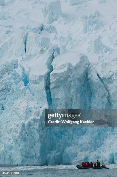 Antarctica, Elephant Island, Point Wild, Tourists In Zodiac In Front Of Glacier.