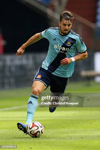 Carl Jenkinson of West Ham United runs with the ball during the match between FC Malaga and West Ham United as part of the Schalke 04 Cup Day at...