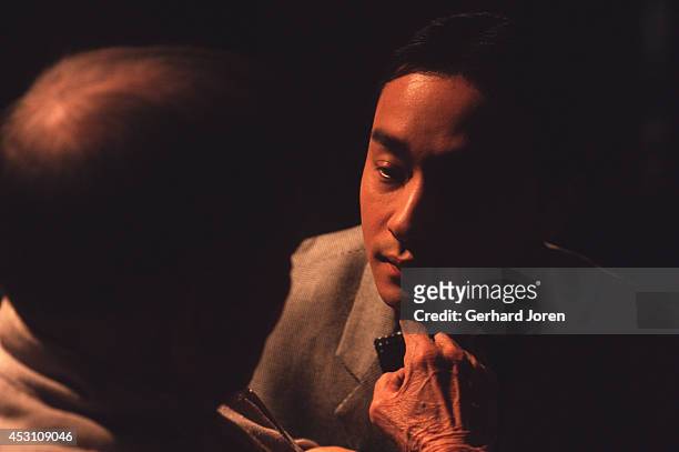 Hong Kong actor Leslie Cheung Kwok Wing with Chinese actor Xie Tian, during the filming of 'Temptress Moon' in Shanghai Film Studios.