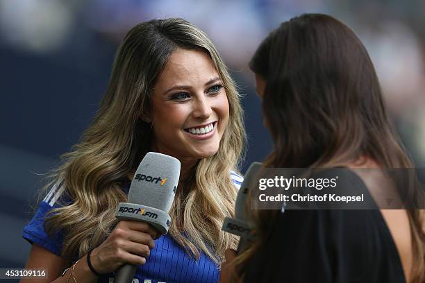 Moderator Vanessa Huppenkothen of Sport 1 television channel speaks to Laura Wontorra of Sport 1 television prior to the match between FC Malaga and...