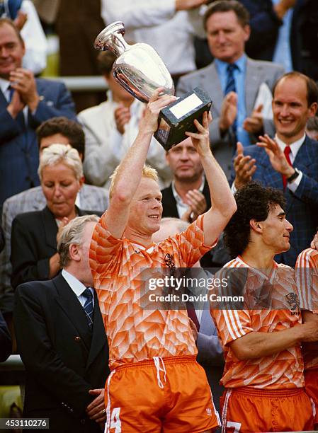 Holland player Ronald Koeman lifts the trophy after the European Championship Final between Holland and USSR at the Olympic Stadium on June 25, 1988...