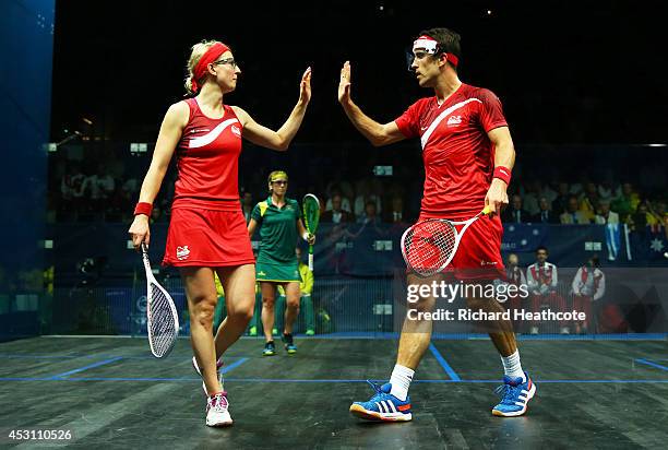 Peter Barker and Alison Waters of England celebrate a point in the Mixed Doubles Gold Medal Match against David Palmer and Rachael Grinham of...