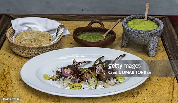 Lamb ribs with radish, "Chile de agua", Mexican green sauce and guacamole, prepared and served by Alejandro Ruiz, chef of the "Casa Oaxaca"...