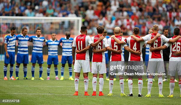 The Ajax and Zwolle players stand for one minute's silence in tribute to the victims of the MH-17 flight prior to the 19th Johan Cruijff Shield match...