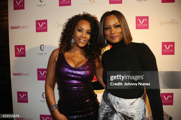 Actresses Vivica A. Fox and Garcelle Beauvais celebrate Vivica A. Fox's 50th birthday at Mr. Chow on August 2, 2014 in Los Angeles, California.