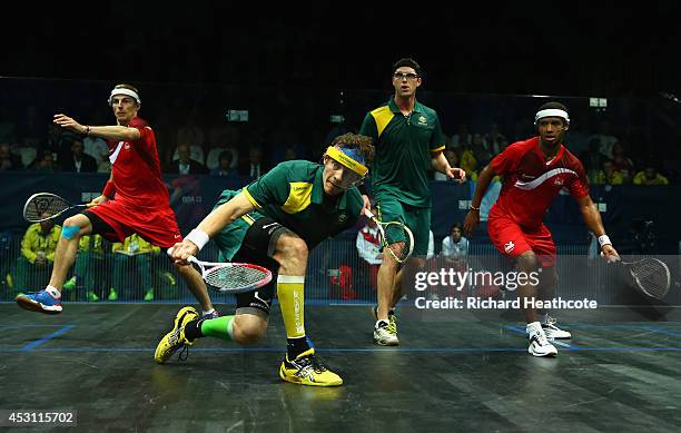 Adrian Grant and Nick Matthew of England and David Palmer and Cameron Pilley of Australia compete in the Men's Doubles Gold Medal Match at Scotstoun...