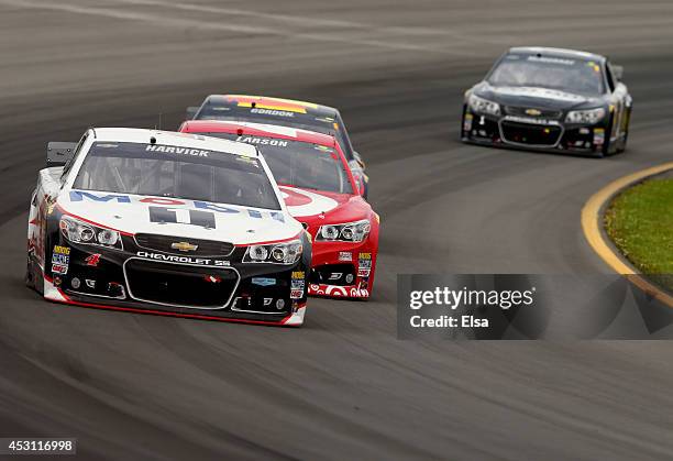 Kevin Harvick, driver of the Mobil 1 Chevrolet, drives ahead of Kyle Larson, driver of the Target Chevrolet, during the NASCAR Sprint Cup Series...