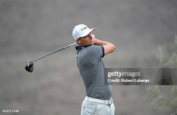 John Mallinger of the United States watches his tee shot on the second hole during the final round of the Barracuda Championship at the Montreux Golf...