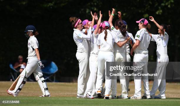 The Middlesex team celebrate a wicket during the Women's County T20 Finals at The RAF Sports Ground on August 03, 2014 in London, England.