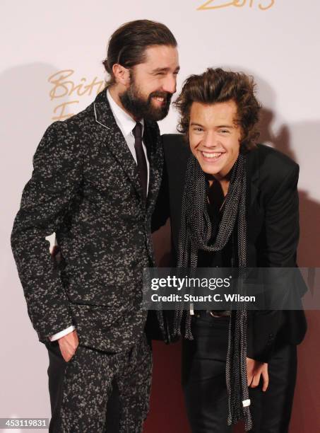 Jack Guinness and Harry Styles with the British Style bought to you by Vodaphone Award and Alexa Chung poses in the winners room at the British...