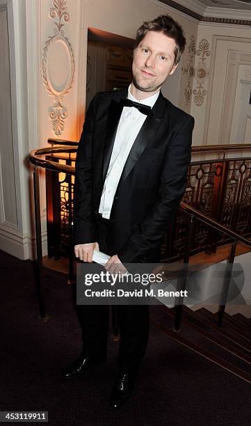 Christopher Bailey, winner of Menswear Designer of the Year, poses at the British Fashion Awards 2013 at London Coliseum on December 2, 2013 in...