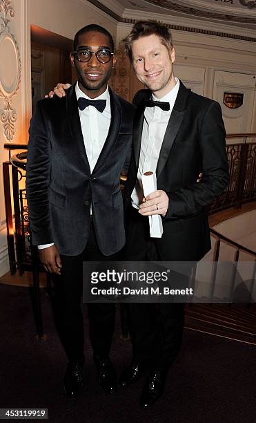 Tinie Tempah and Christopher Bailey, winner of Menswear Designer of the Year, pose at the British Fashion Awards 2013 at London Coliseum on December...