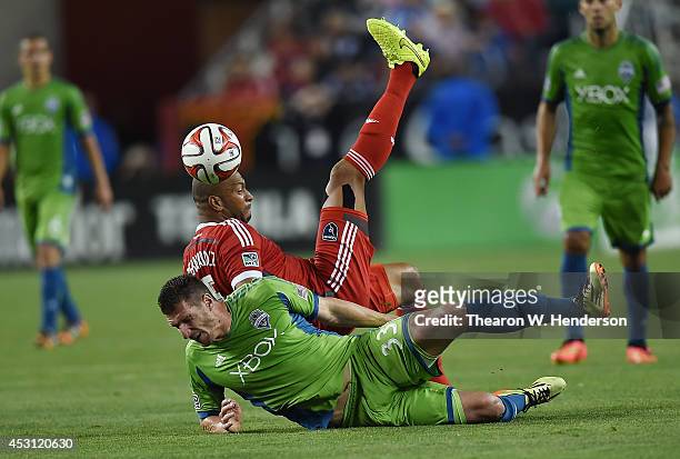Victor Bernardez of the San Jose Earthquakes battle for the ball with Kenny Cooper of the Seattle Sounder FC during the second half of an MLS Soccer...