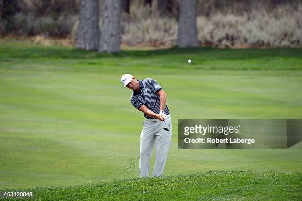 John Mallinger of the United States chips to the eighth green during the final round of the Barracuda Championship at the Montreux Golf and Country...
