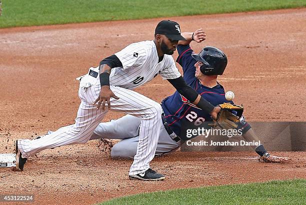 Eric Fryer of the Minnesota Twins steals second base in the 2nd inning as Alexei Ramirez of the Chicago White Sox misses the throw at U.S. Cellular...