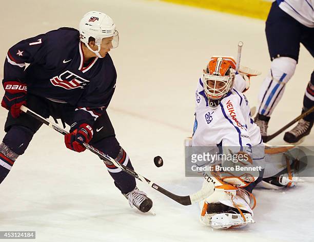 Juuse Saros of Team Finland makes the second period save against Anders Bjork of USA Blue during the 2014 USA Hockey Junior Evaluation Camp at the...