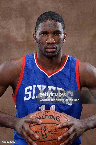Joel Embiid of the Philadelphia 76ers poses for a portrait during the 2014 NBA rookie photo shoot on August 3, 2014 at the Madison Square Garden...