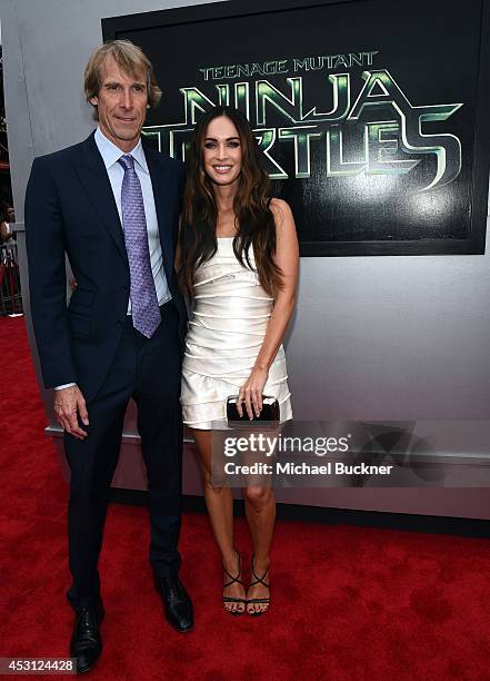Producer Michael Bay and actress Megan Fox attends the premiere of Paramount Pictures' "Teenage Mutant Ninja Turtles" at Regency Village Theatre on...