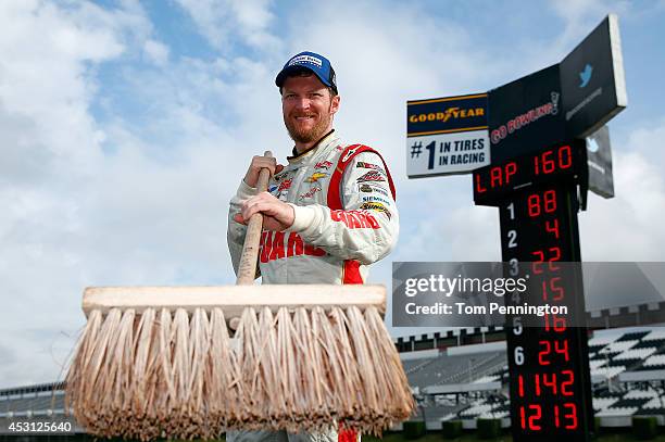 Dale Earnhardt Jr., driver of the Michael Baker International Chevrolet, poses after winning the NASCAR Sprint Cup Series GoBowling.com 400 at Pocono...