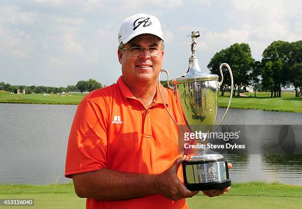 Kenny Perry poses with the trophy after winning the 3M Championship at TPC Twin Cities on August 3, 2014 in Blaine, Minnesota.