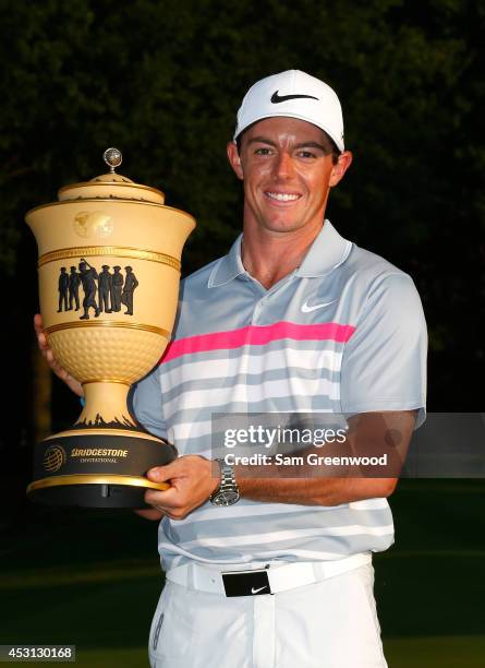 Rory McIlroy of Northern Ireland holds the Gary Player Cup trophy after winning the World Golf Championships-Bridgestone Invitational with a score of...