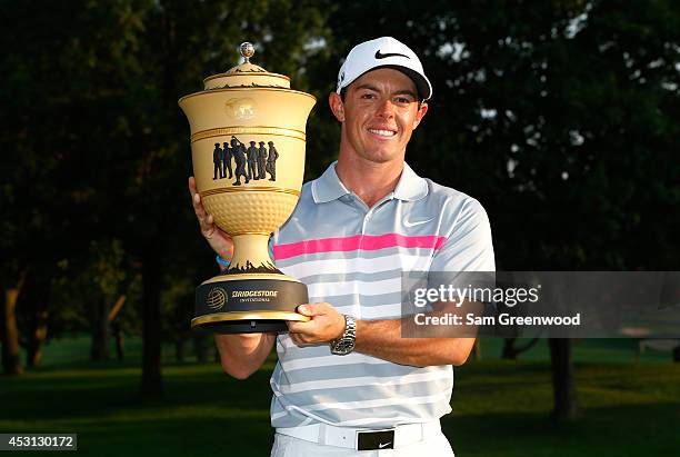 Rory McIlroy of Northern Ireland holds the Gary Player Cup trophy after winning the World Golf Championships-Bridgestone Invitational with a score of...